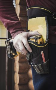 Builder reaching for a tool